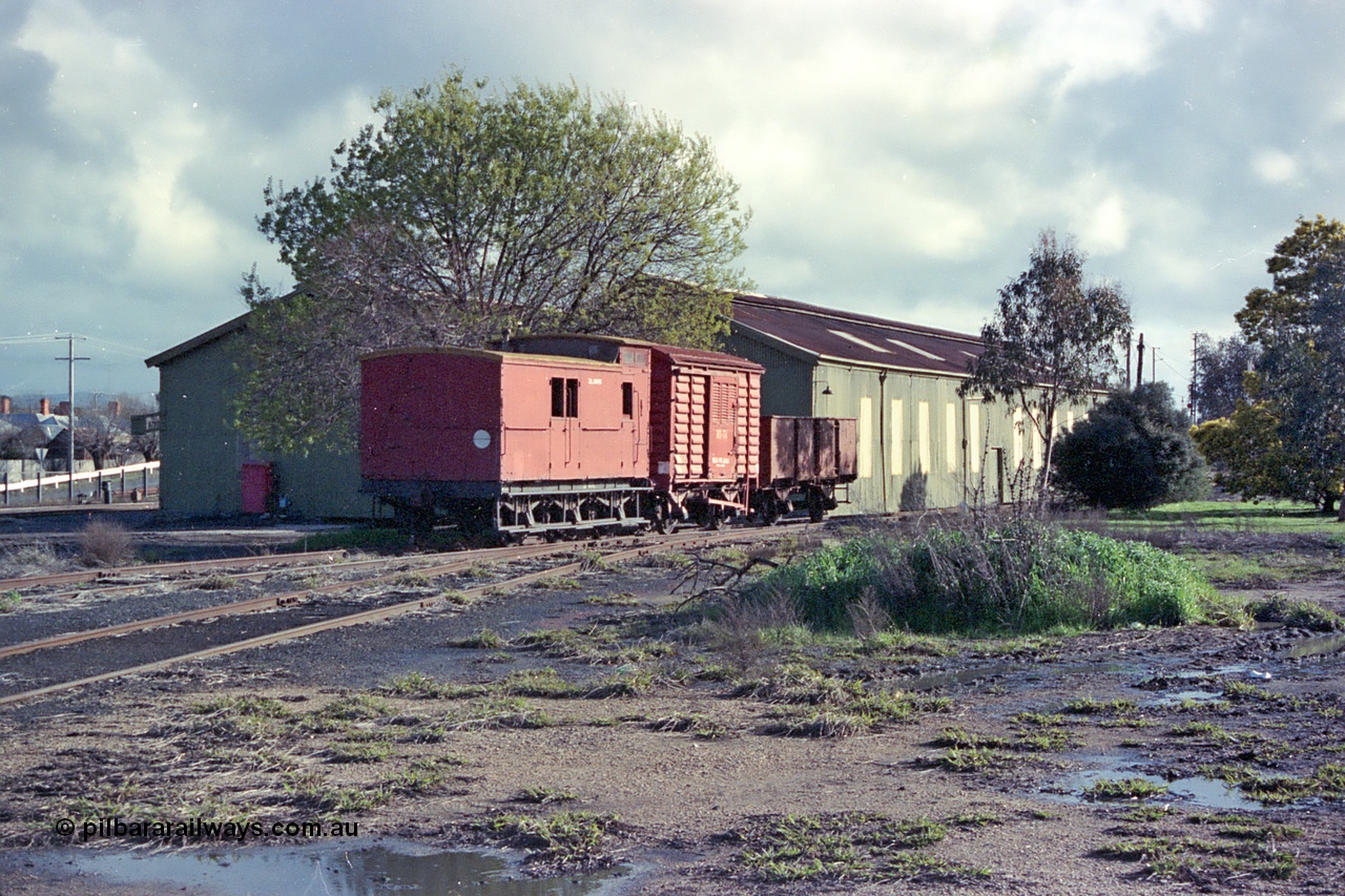 103-21
Benalla Workshops, broad gauge ZL type guards van ZL 395, HD type four wheel departmental van HD 74 and G type four wheel open waggon G 130, workshops behind waggons, loco turntable to left of scene.
Keywords: ZL-van;ZL395;Z-van;Z395;HD-type;HD74;G-type;G130;GY-type;fixed-wheel-waggon;