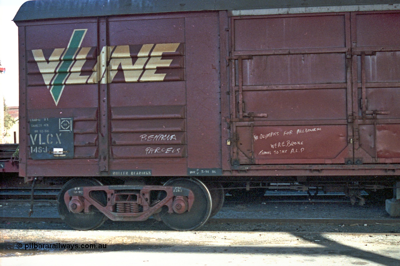 103-26
Benalla, broad gauge V/Line VLCX type bogie louvre van VLCX 148 built by Victorian Railways Bendigo Workshops as a VLX type louvre van in June 1965, recoded in 1979 to VLCX, Freightgate shed, close up of bogie, number board.
Keywords: VLCX-type;VLCX148;Victorian-Railways-Bendigo-WS;VLX-type;