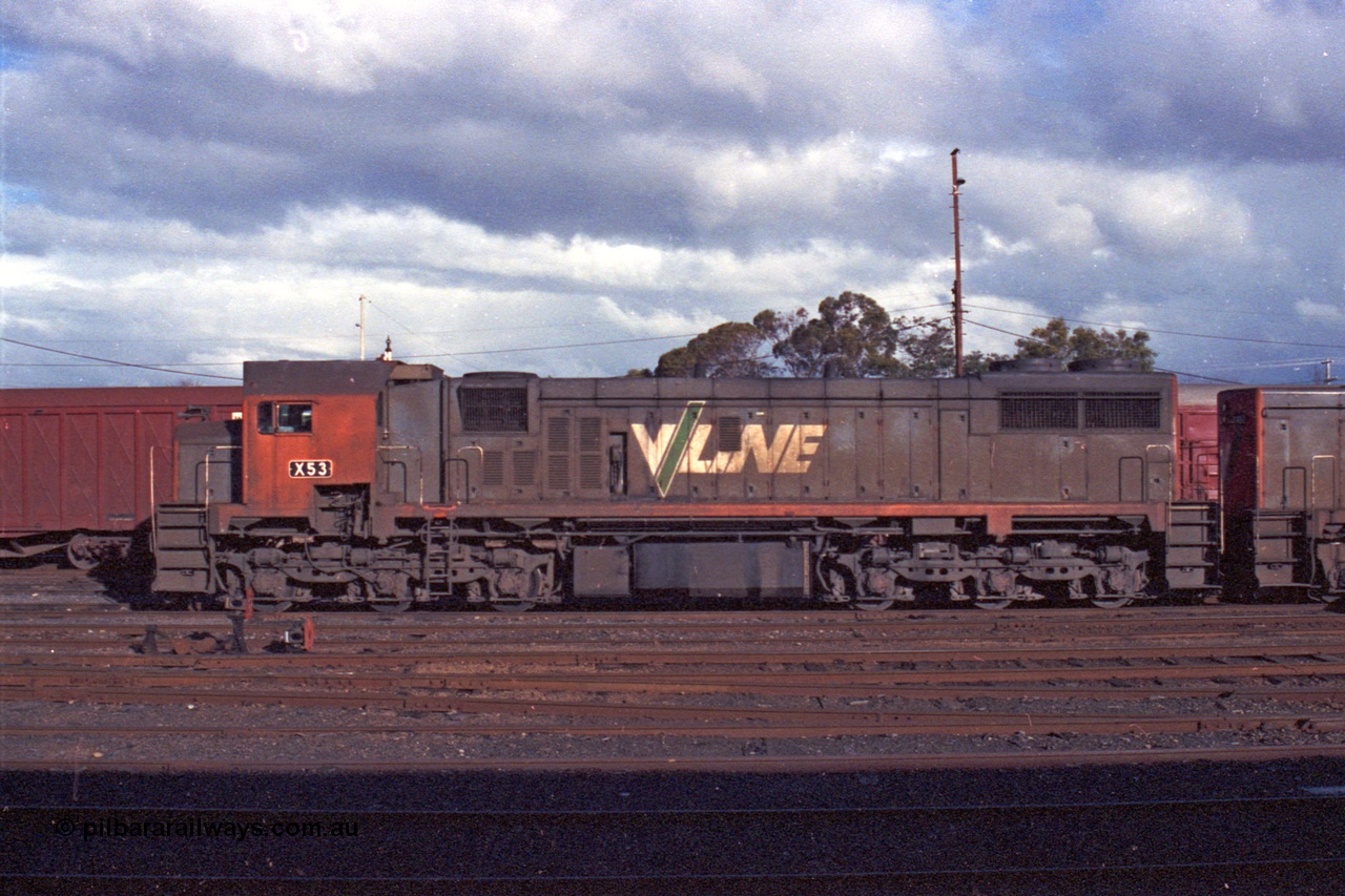 103-31
Benalla station yard, broad gauge V/Line X class loco X 53 with serial 75-800 a Clyde Engineering Rosewater SA built EMD model G26C, lbs view, dwarf disc signals, track work.
Keywords: X-class;X53;Clyde-Engineering-Rosewater-SA;EMD;G26C;75-800;