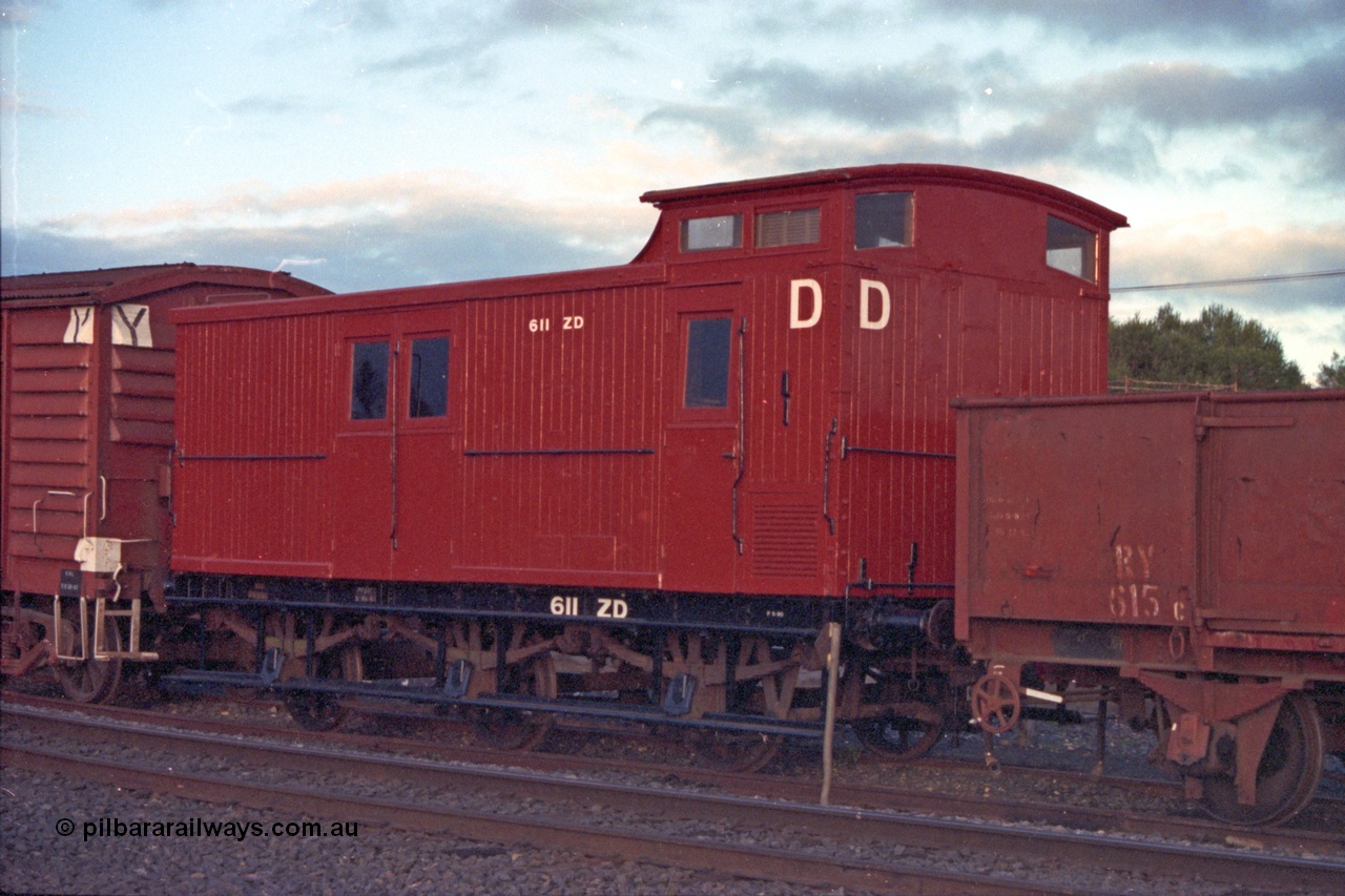 103-34
Seymour ZD type six wheel guards van ZD 611, originally built as a Z van by Victorian Railways Newport Workshops in December 1928 - to ZP in the 1960s and ZD in 1975, coupled to RY type four wheel open waggon RY 615.
Keywords: ZD-van;ZD611;Victorian-Railways-Newport-WS;Z-type;RY-type;RY615;fixed-wheel-waggon;