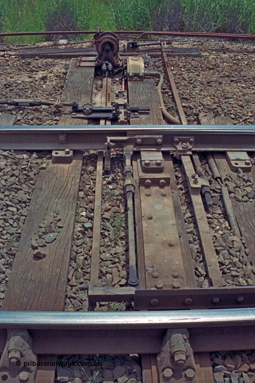 104-07
Buangor crossing loop, detail shot of point blades, rodding and signal wires and the interlocking arrangements at the west end points including plunger, detectors and electric switch lock.
