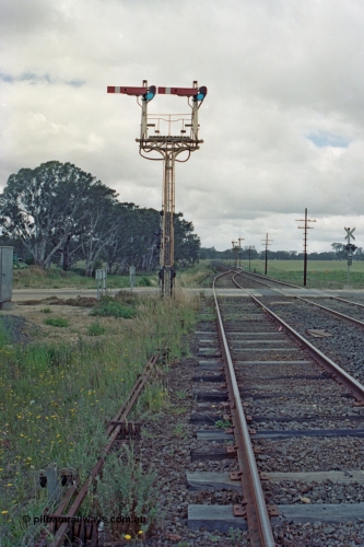 104-14
Buangor crossing loop, yard view looking east, mechanical somersault semaphore signal post 3, Up Home, facing camera for Melbourne bound trains, mechanical somersault semaphore signal post 2, Down Home, in the distance for Ararat bound traffic.
