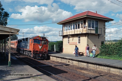 104-20
Wallan station overview looking in a down direction, broad gauge V/Line N class loco N 465 'City of Ballaarat' with serial 86-1194 a Clyde Engineering Somerton Victoria built EMD model JT22HC-2 and N set with an up Albury pass, signaller watches from the elevated signal box built in 1916 with a 40 lever A pattern frame replacing a 20 lever frame on the Down platform.
Keywords: N-class;N465;Clyde-Engineering-Somerton-Victoria;EMD;JT22HC-2;86-1194;