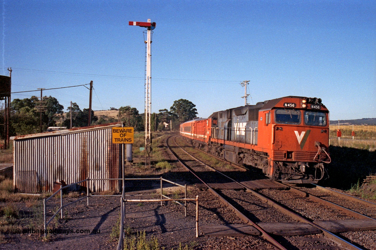 105-08
Wallan, broad gauge V/Line N class loco N 456 'City of Colac' with serial 85-1224 a Clyde Engineering Somerton Victoria built EMD model JT22HC-2 arrives with an up Albury passenger train, gangers trolley shed, crib crossing and semaphore signal post 12 for down movements.
Keywords: N-class;N456;Clyde-Engineering-Somerton-Victoria;EMD;JT22HC-2;85-1224;