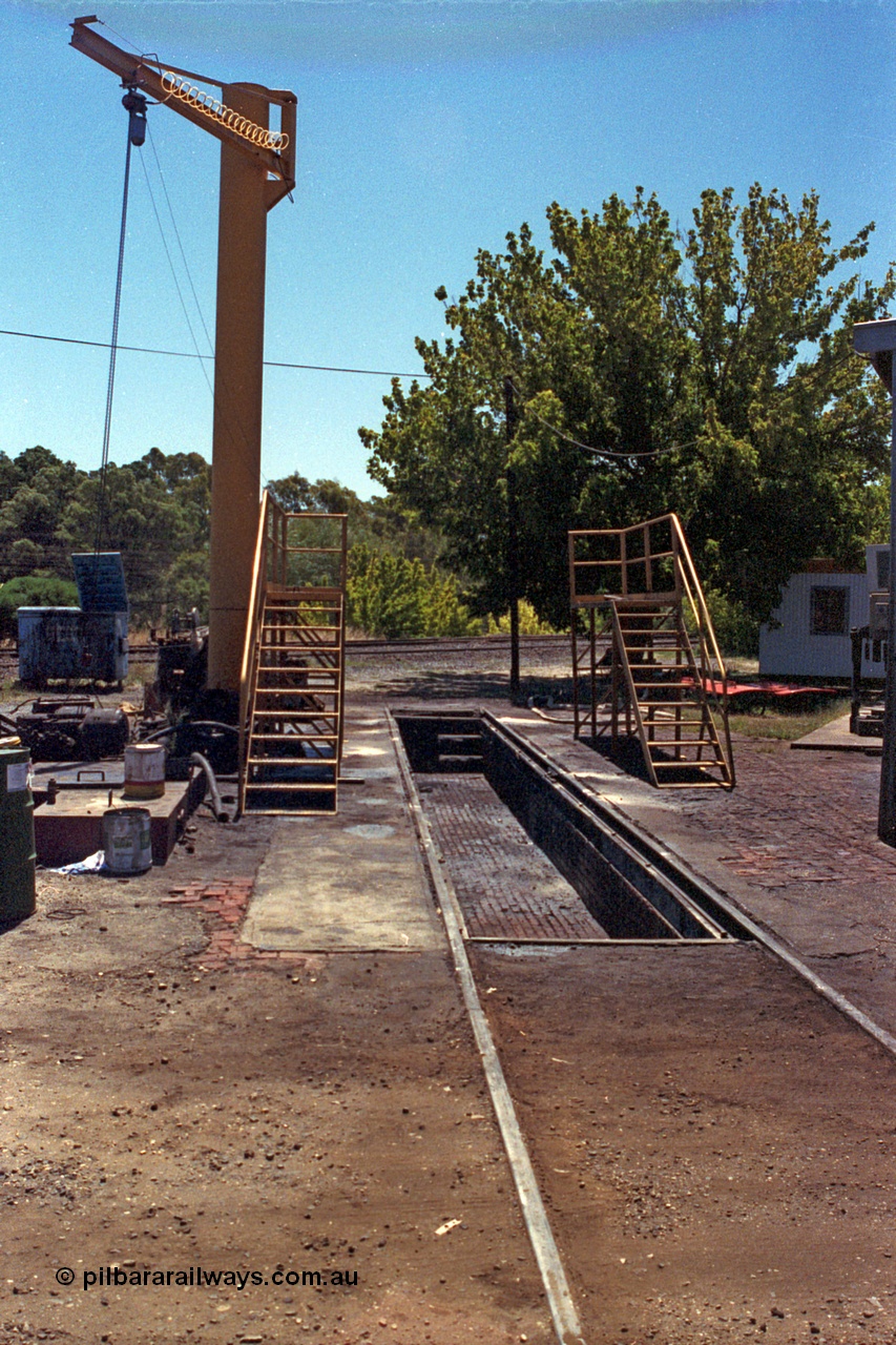 105-31
Seymour loco depot inspection pit road with davit hoist and portable inspection walkways.
