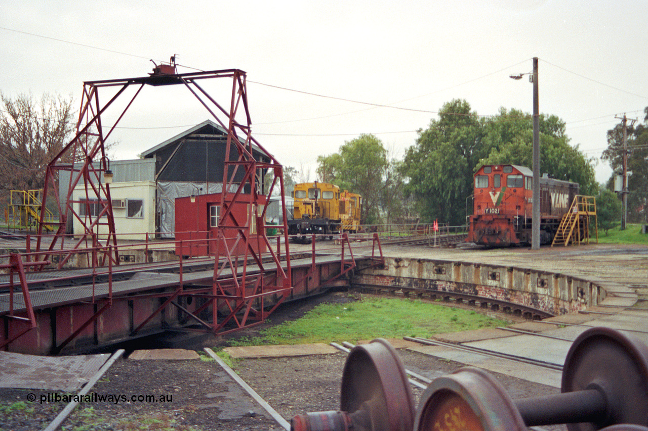 106-27
Seymour loco depot turntable and pit, V/Line standard gauge Y class Y 102 Clyde Engineering EMD model G6B serial 63-292, turntable, gantry and pit, loco shed, rail tractor RT class and Aresco Trak Chief RT 46, wheel sets at right.
Keywords: Y-class;Y102;Clyde-Engineering-Granville-NSW;EMD;G6B;63-292;RT-class;RT46;Aresco;Trak-Chief;rail-tractor;