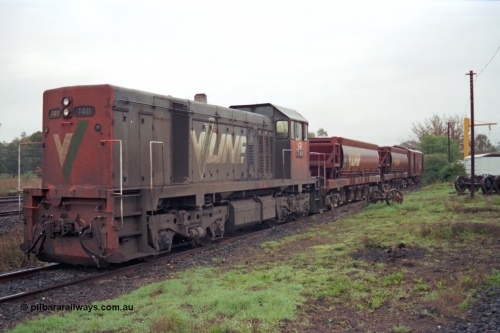 106-24
Seymour loco depot, V/Line standard gauge T class T 411 Clyde Engineering EMD model G18B serial 68-627 with a short stabled standard gauge ballast train with two VZMF type bogie ballast waggons.
Keywords: T-class;T411;Clyde-Engineering-Granville-NSW;EMD;G18B;68-627;VZMF-type;