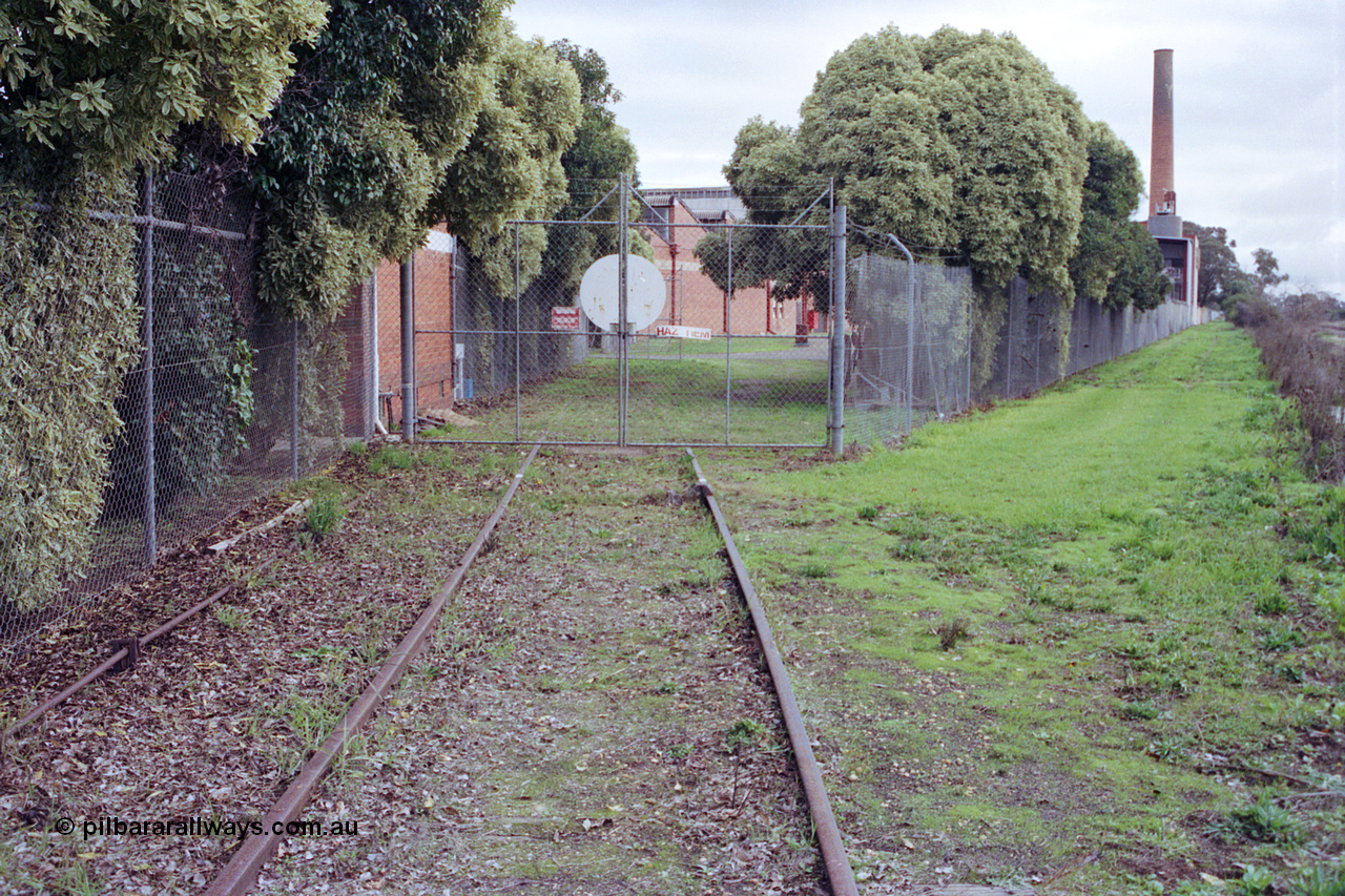 107-02
Kyabram track view, Kyabram Co-op Fruit Preserving Company and Southern Can Company sidings and factory gates, point rodding and derailer.
