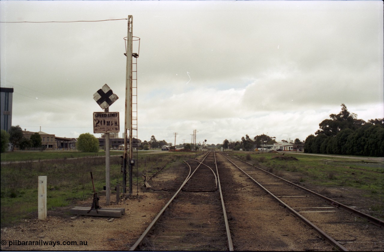 107-12
Tongala station yard, Nestle factory siding with staff locked points looking north, 20 MPH speed board.
