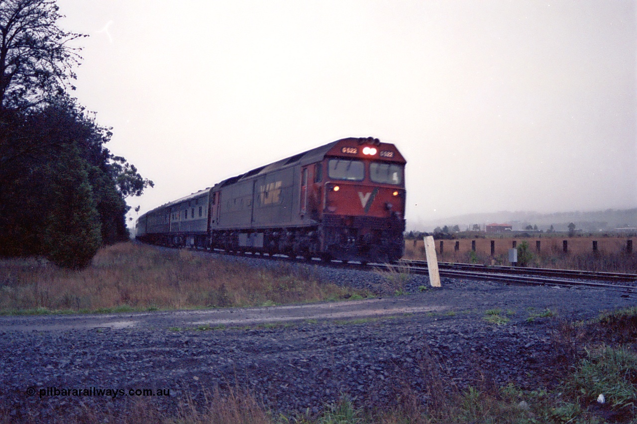 109-04
Wallan Loop, standard gauge V/Line G class G 522 Clyde Engineering EMD model JT26C-2SS serial 86-1235 up Melbourne Express.
Keywords: G-class;G522;Clyde-Engineering-Rosewater-SA;EMD;JT26C-2SS;86-1235;