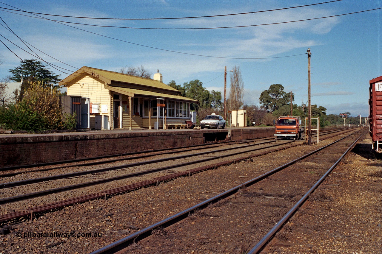 109-19
Avenal station building and platform, Hi-Rail truck on mainline, point rodding and staff exchange platform.
