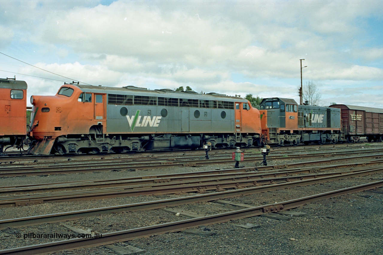 110-03
Benalla yard view, broad gauge V/Line B class B 64 Clyde Engineering EMD model ML2 serial ML2-5 and V/Line T class loco T 403 with serial 67-498 a Clyde Engineering Granville NSW built EMD model G18B, stabled down Wodonga goods train 9303, point indicators and ground disc signals.
Keywords: B-class;B64;Clyde-Engineering-Granville-NSW;EMD;ML2;ML2-5;bulldog;T-class;T403;G18B;67-498;