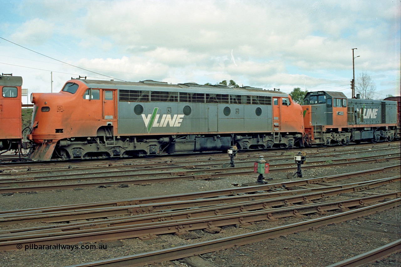 110-04
Benalla yard view, broad gauge V/Line B class B 64 Clyde Engineering EMD model ML2 serial ML2-5 and V/Line T class loco T 403 with serial 67-498 a Clyde Engineering Granville NSW built EMD model G18B, stabled down Wodonga goods train 9303, point indicators and ground disc signals.
Keywords: B-class;B64;Clyde-Engineering-Granville-NSW;EMD;ML2;ML2-5;bulldog;T-class;T403;G18B;67-498;