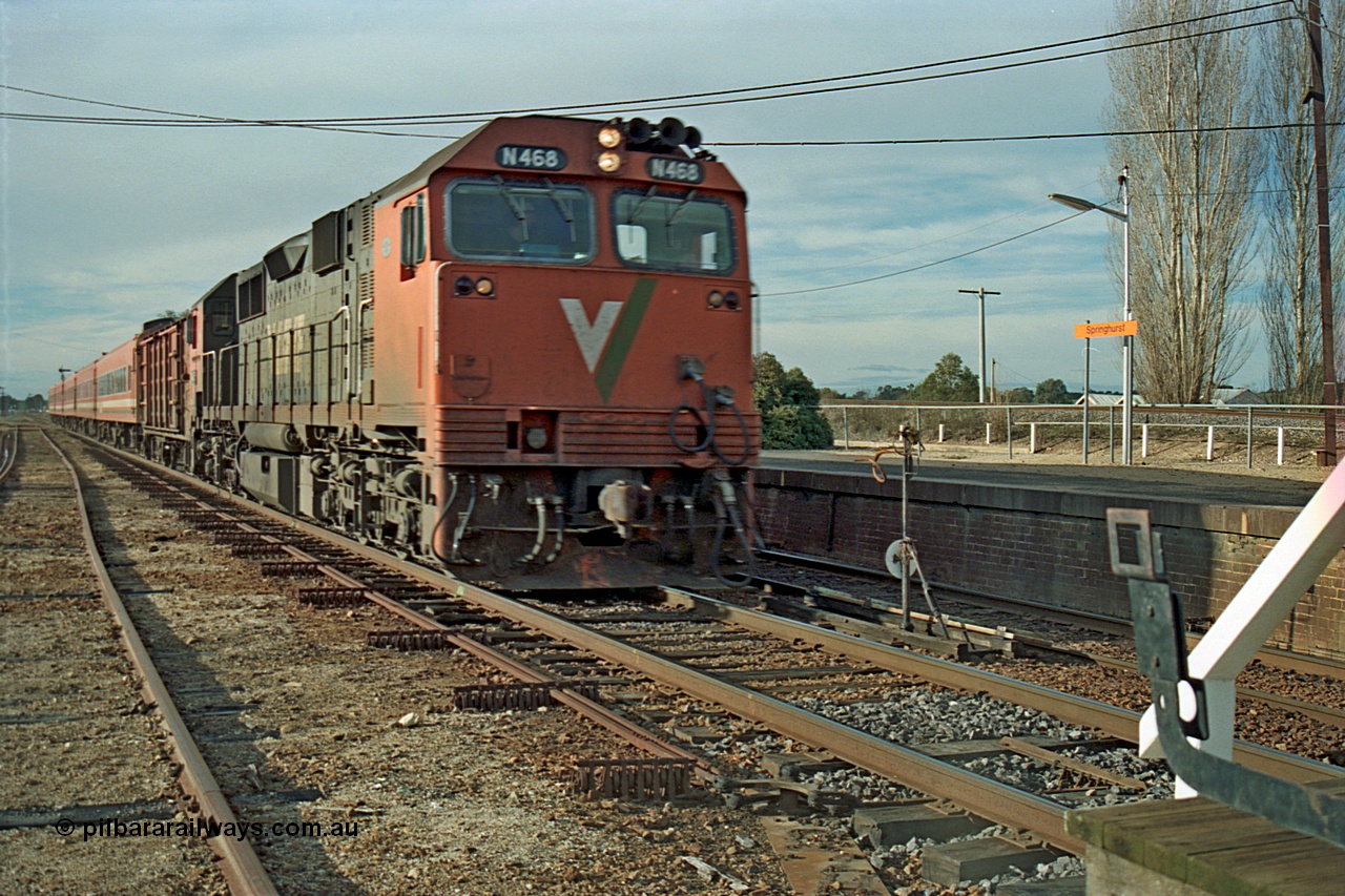 110-16
Springhurst, V/Line broad gauge N class N 468 'City of Bairnsdale' Clyde Engineering EMD model JT22HC-2 serial 86-1197 with D van and N set operate an up Albury passenger about to exchange the electric staff 'on the auto' express on the mainline, at speed, point rodding, staff exchange apparatus.
Keywords: N-class;N468;Clyde-Engineering-Somerton-Victoria;EMD;JT22HC-2;86-1197;