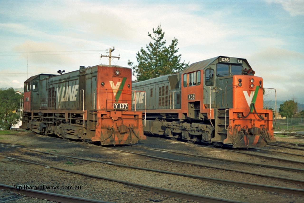 110-18
Wodonga loco depot, turntable roads, V/Line broad gauge Y class Y 137 Clyde Engineering EMD model G6B serial 65-403 and X class X 36 Clyde Engineering EMD model G16C serial 66-489 rest between jobs.
Keywords: Y-class;Y137;Clyde-Engineering-Granville-NSW;EMD;G6B;65-403;X-class;X36;G16C;66-489;