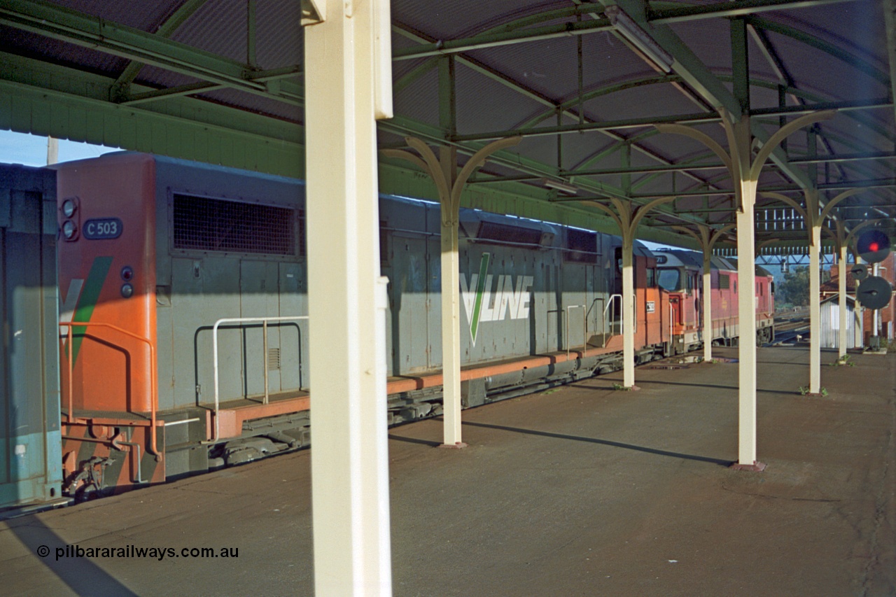 110-19
Albury station platform, V/Line standard gauge C class C 503 Clyde Engineering EMD model GT26C serial 76-826 and NSWSRA 81 class 8171 Clyde Engineering EMD model JT26C-2SS serial 85-1090 with an up goods train waits departure time south, signal at right of frame is for the broad gauge passenger platform.
Keywords: C-class;C503;Clyde-Engineering-Rosewater-SA;EMD;GT26C;76-826;81-class;8171;JT26C-2SS;85-1090;