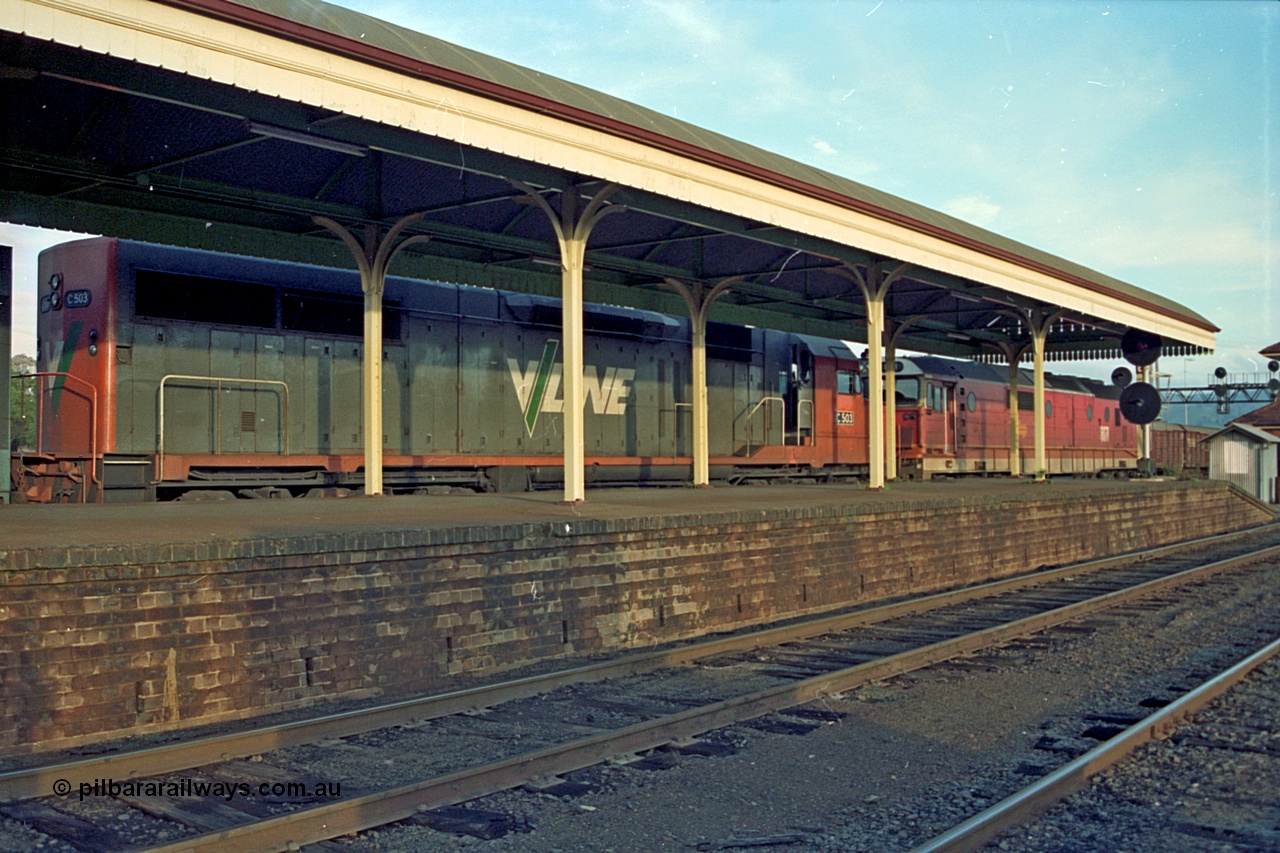 110-21
Albury station platform, V/Line standard gauge C class C 503 Clyde Engineering EMD model GT26C serial 76-826 and NSWSRA 81 class 8171 Clyde Engineering EMD model JT26C-2SS serial 85-1090 on an up goods train on the standard gauge side, V/Line broad gauge tracks in the foreground.
Keywords: C-class;C503;Clyde-Engineering-Rosewater-SA;EMD;GT26C;76-826;81-class;8171;JT26C-2SS;85-1090;