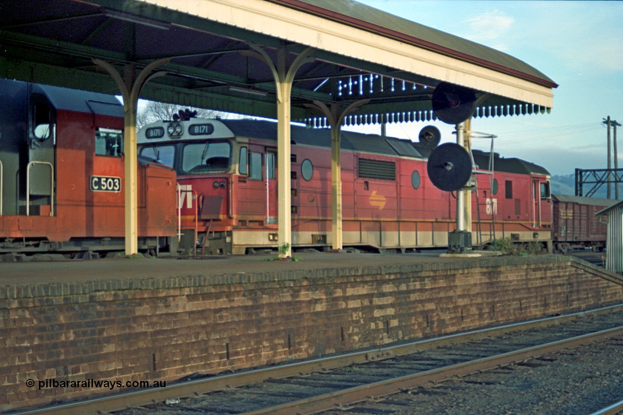 110-22
Albury station platform, NSWSRA standard gauge 81 class 8171 Clyde Engineering EMD model JT26C-2SS serial 85-1090 leads V/Line C class C 503 Clyde Engineering EMD model GT26C serial 76-826 with an up goods, broad gauge tracks and signal in foreground.
Keywords: 81-class;8171;Clyde-Engineering-Kelso-NSW;EMD;JT26C-2SS;85-1090;C-class;C503;GT26C;76-826;