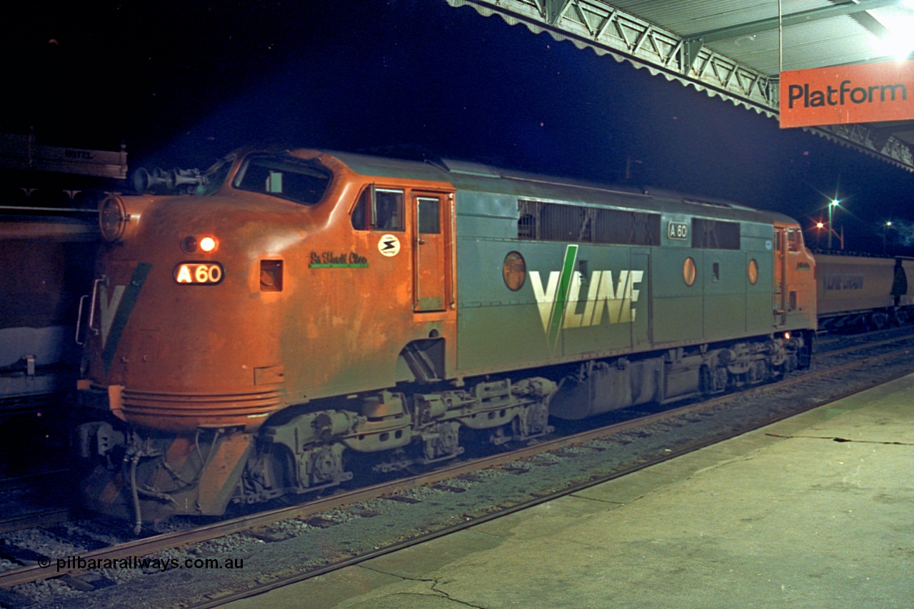 110-26
Seymour station platform, V/Line broad gauge A class locomotive A 60 'Sir Harold Clapp' Clyde Engineering EMD model AAT22C-2R serial 84-1184 rebuilt from B 60 'Sir Harold Clapp' Clyde Engineering EMD model ML2 serial ML2-1 waiting to run the Sunday evening down Cobram passenger train 8345.
Keywords: A-class;bulldog;A60;Clyde-Engineering-Rosewater-SA;EMD;AAT22C-2R;84-1184;rebuild;