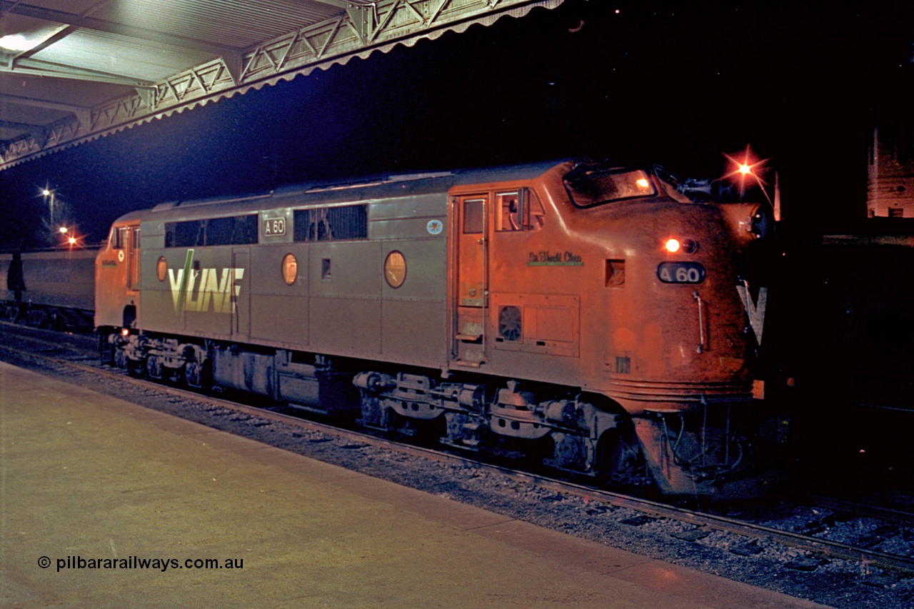 110-27
Seymour station platform, V/Line broad gauge A class locomotive A 60 'Sir Harold Clapp' Clyde Engineering EMD model AAT22C-2R serial 84-1184 rebuilt from B 60 'Sir Harold Clapp' Clyde Engineering EMD model ML2 serial ML2-1 waiting to run the Sunday evening down Cobram passenger train 8345.
Keywords: A-class;A60;Clyde-Engineering-Rosewater-SA;EMD;AAT22C-2R;84-1184;rebuild;bulldog;