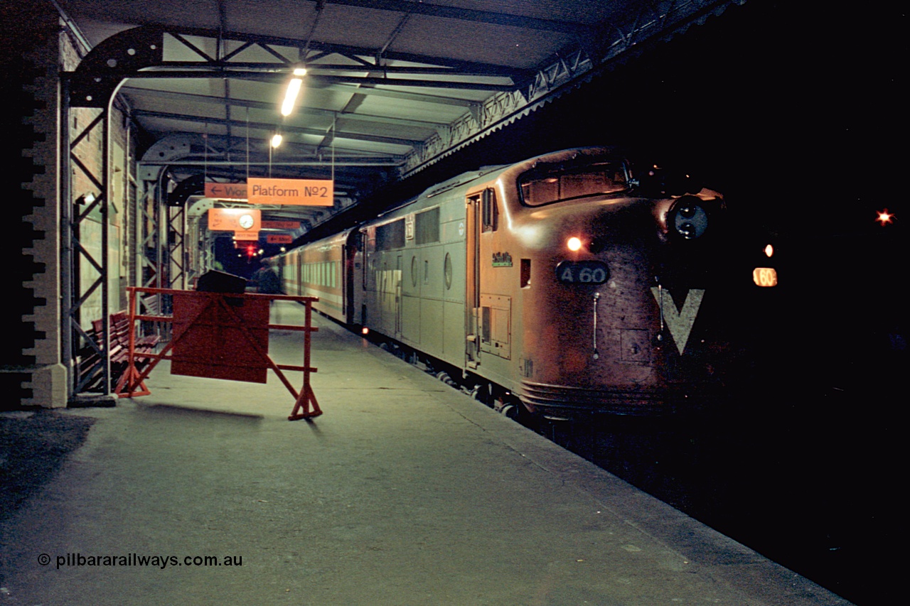 110-32
Seymour station platform two, V/Line broad gauge A class A 60 'Sir Harold Clapp' Clyde Engineering EMD model AAT22C-2R serial 84-1184 rebuilt from B 60 'Sir Harold Clapp' Clyde Engineering EMD model ML2 serial ML2-1, down Cobram passenger train 8345.
Keywords: A-class;bulldog;A60;Clyde-Engineering-Rosewater-SA;EMD;AAT22C-2R;84-1184;rebuild;