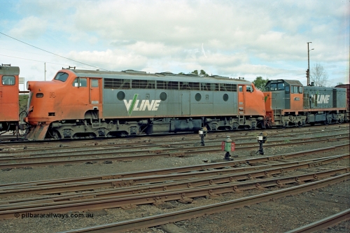 110-04
Benalla yard view, broad gauge V/Line B class B 64 Clyde Engineering EMD model ML2 serial ML2-5 and V/Line T class loco T 403 with serial 67-498 a Clyde Engineering Granville NSW built EMD model G18B, stabled down Wodonga goods train 9303, point indicators and ground disc signals.
Keywords: B-class;B64;Clyde-Engineering-Granville-NSW;EMD;ML2;ML2-5;bulldog;T-class;T403;G18B;67-498;