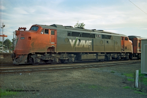 110-17
Wodonga station, V/Line broad gauge A class A 66 Clyde Engineering EMD model AAT22C-2R serial 84-1186 rebuilt from B 66 Clyde Engineering EMD model ML2 serial ML2-7 with a down Albury passenger train pausing at the platform.
Keywords: A-class;A66;Clyde-Engineering-Rosewater-SA;EMD;AAT22C-2R;84-1186;rebuild;bulldog;
