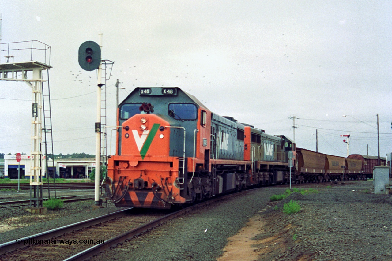 111-12
North Geelong C Box, V/Line broad gauge up Mt Gambier goods train 9192 heads around the Loop Line bound for Melbourne behind X class X 48 Clyde Engineering EMD model G26C serial 75-795 and older sister X 42 serial 70-705, signal post 19 is the down home signal for the Loop Line.
Keywords: X-class;X48;Clyde-Engineering-Rosewater-SA;EMD;G26C;75-795;