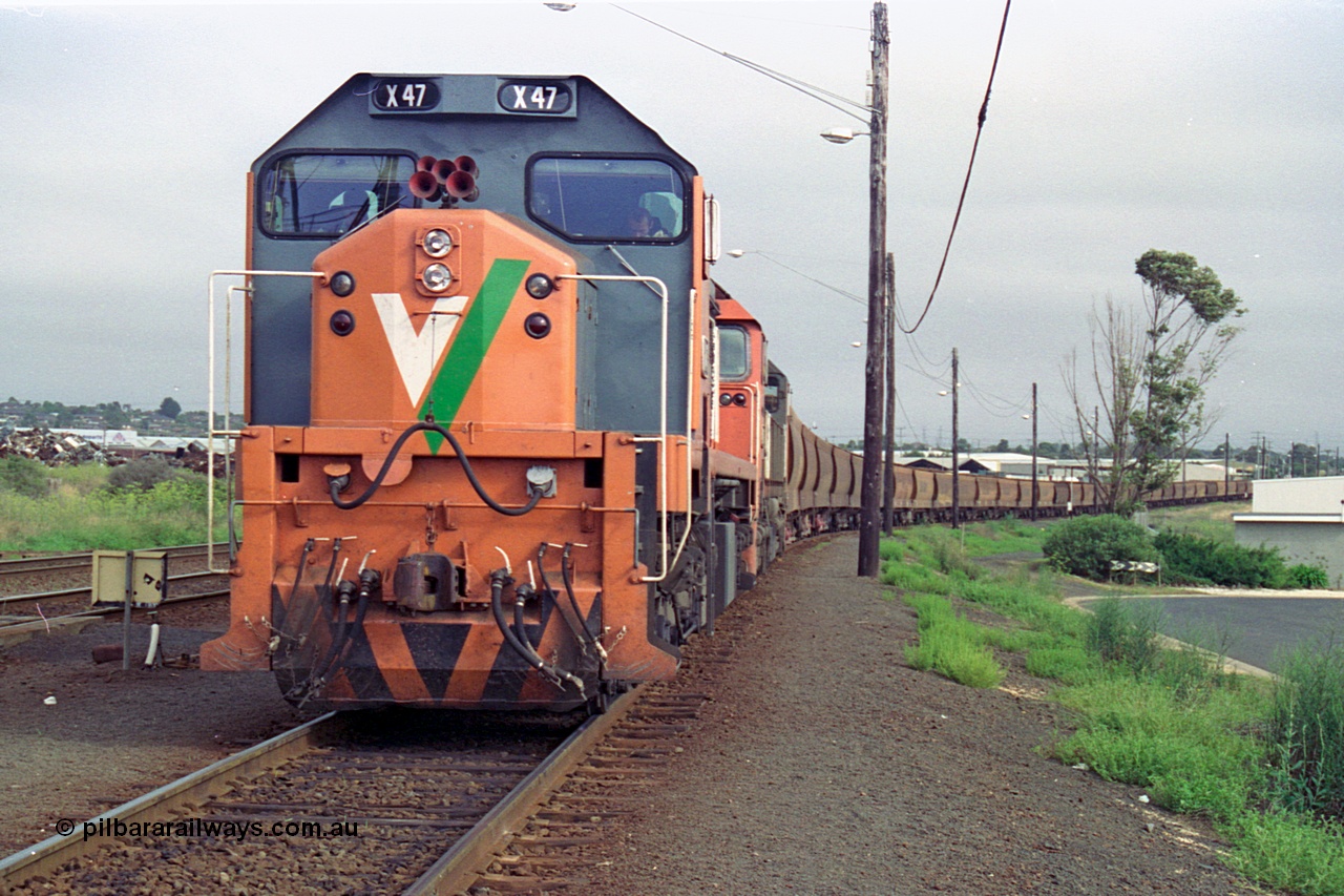 111-16
North Geelong grain arrivals yard, V/Line broad gauge loco X class X 47 Clyde Engineering EMD model G26C serial 75-794 and N class N 461 'City of Ararat' Clyde Engineering EMD model JT22HC-2 serial 86-1190 with a loaded grain loop have their crib break before heading back to the grain loop.
Keywords: X-class;X47;Clyde-Engineering-Rosewater-SA;EMD;G26C;75-794;