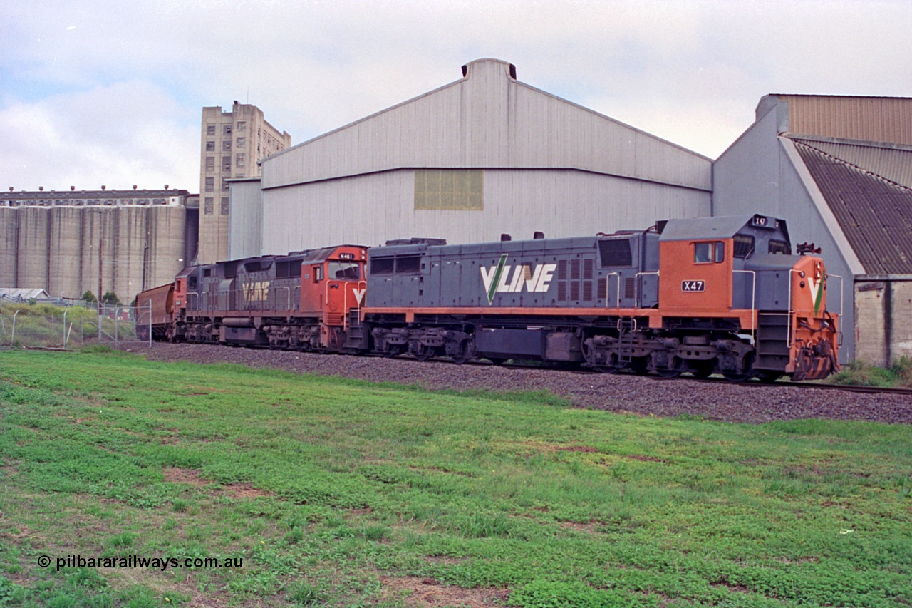 111-22
North Geelong grain loop, V/Line broad gauge locos X class X 47 Clyde Engineering EMD model G26C serial 75-794 and N class N 461 'City of Ararat' Clyde Engineering EMD model JT22HC-2 serial 86-1190 unload their train, grain complex behind locos.
Keywords: X-class;X47;Clyde-Engineering-Rosewater-SA;EMD;G26C;75-794;