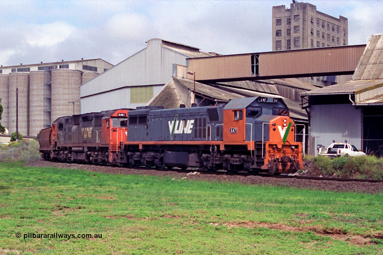 111-23
North Geelong grain loop, V/Line broad gauge locos X class X 47 Clyde Engineering EMD model G26C serial 75-794 and N class N 461 'City of Ararat' Clyde Engineering EMD model JT22HC-2 serial 86-1190 on the grain loop unloading their train, grain complex behind locos.
Keywords: X-class;X47;Clyde-Engineering-Rosewater-SA;EMD;G26C;75-794;