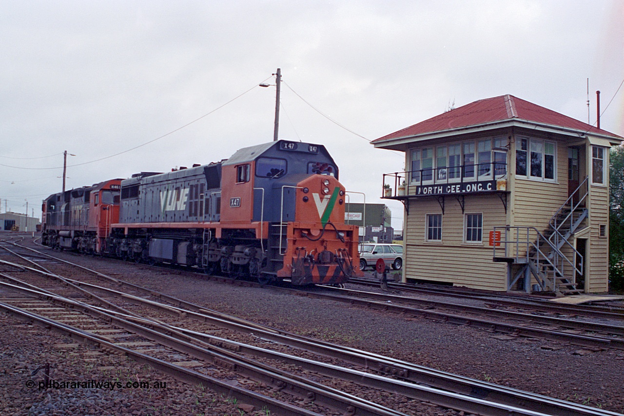 111-25
North Geelong C Box, V/Line broad gauge locomotives X class X 47 Clyde Engineering EMD model G26C serial 75-794 and N class N 461 'City of Ararat' Clyde Engineering EMD model JT22HC-2 serial 86-1190 run from the sorting yard back to the grain arrivals yard, ground dwarf disc signal 18 is pulled off for the move, signal box.
Keywords: X-class;X47;Clyde-Engineering-Rosewater-SA;EMD;G26C;75-794;