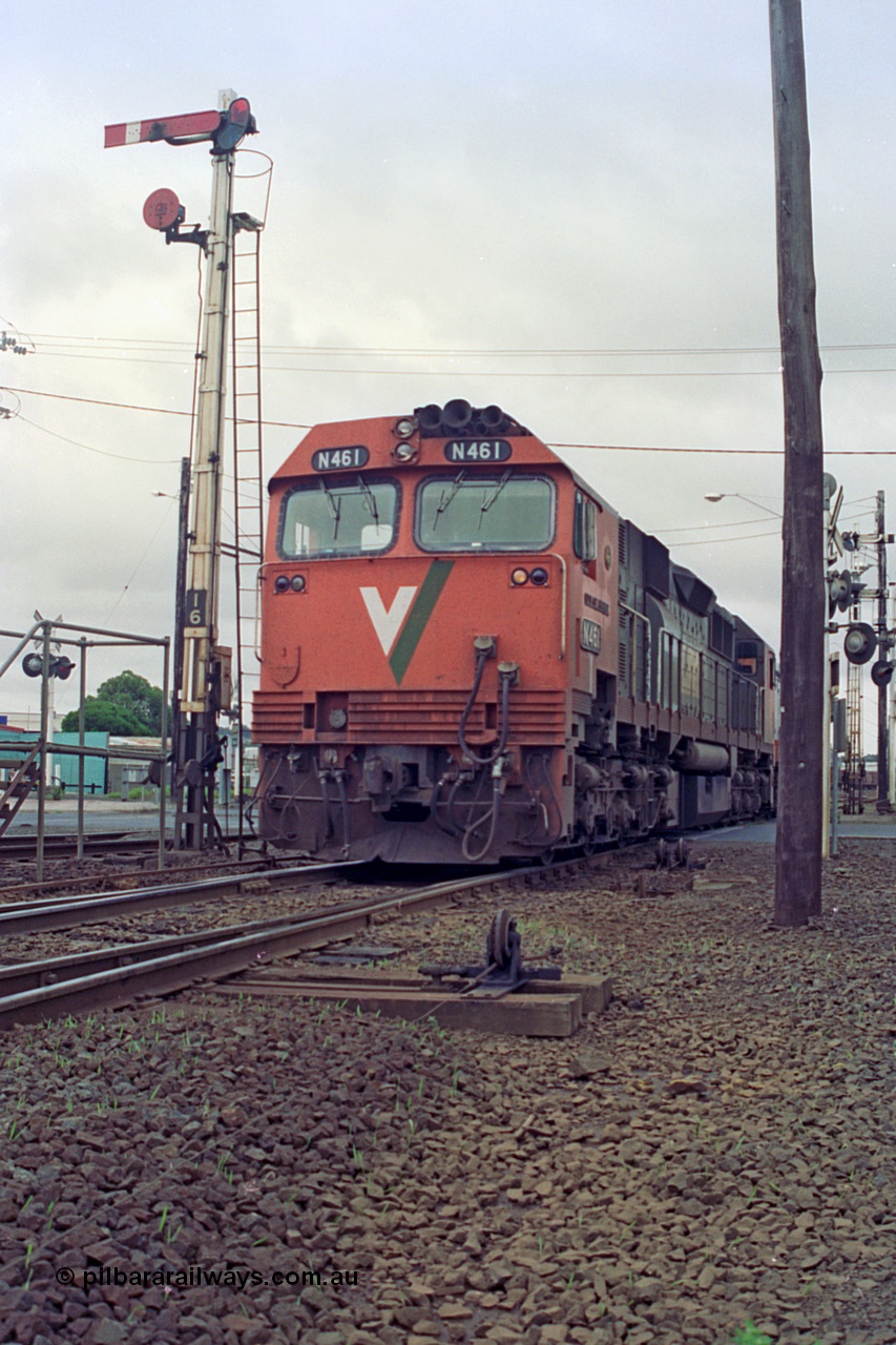 111-26
North Geelong C Box, V/Line broad gauge locomotives N class N 461 'City of Ararat' Clyde Engineering EMD model JT22HC-2 serial 86-1190 with X class X 47 Clyde Engineering EMD model G26C serial 75-794 run past semaphore signal post 16 with another loaded grain train from the grain arrival roads bound for the grain loop.
Keywords: N-class;N461;Clyde-Engineering-Somerton-Victoria;EMD;JT22HC-2;86-1190;