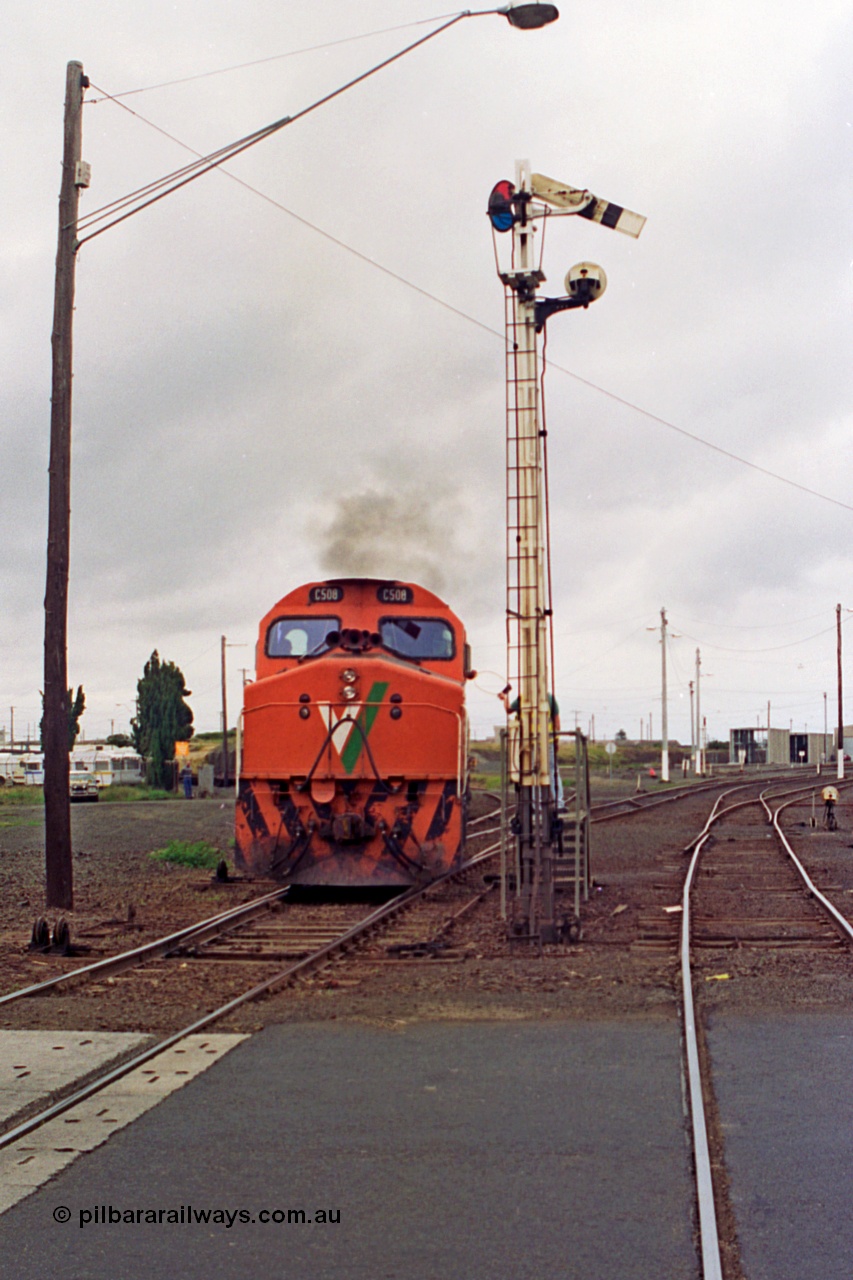 111-31
North Geelong C Box, V/Line down broad gauge goods train 9169 to Adelaide via Cressy with C class C 508 Clyde Engineering EMD model GT26C serial 76-831 powers around the Loop Line and obtains the electric staff for the Gheringhap section off the signaller at semaphore signal post 16.
Keywords: C-class;C508;Clyde-Engineering-Rosewater-SA;EMD;GT26C;76-831;