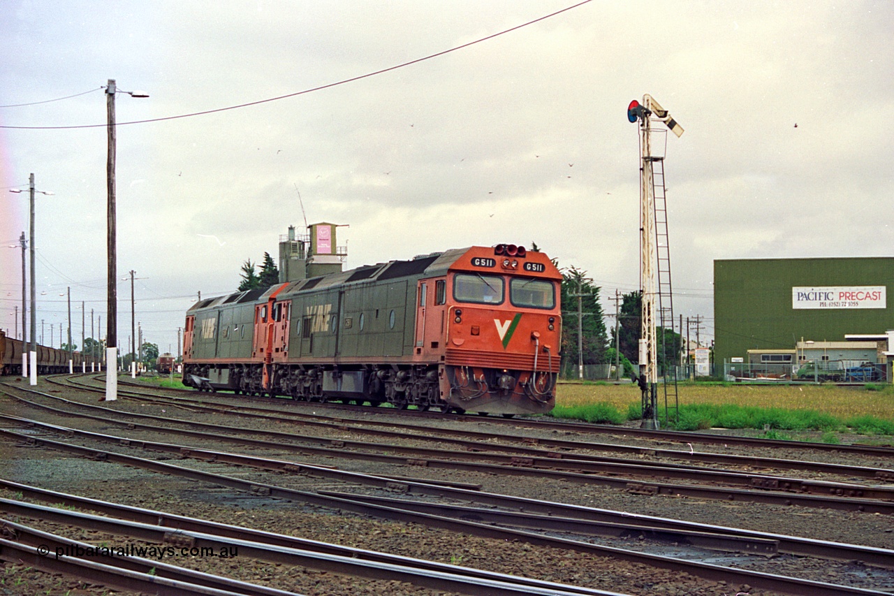 111-34
North Geelong yard, V/Line broad gauge light engines Series 1 G class leader G 511 Clyde Engineering EMD model JT26C-2SS serial 84-1239 and G 538 Clyde Engineering EMD model JT26C-2SS serial 89-1271 arrive at semaphore signal post 17 from Geelong loco depot destined for empty grain train 9123, track and yard view.
Keywords: G-class;G511;Clyde-Engineering-Rosewater-SA;EMD;JT26C-2SS;84-1239;