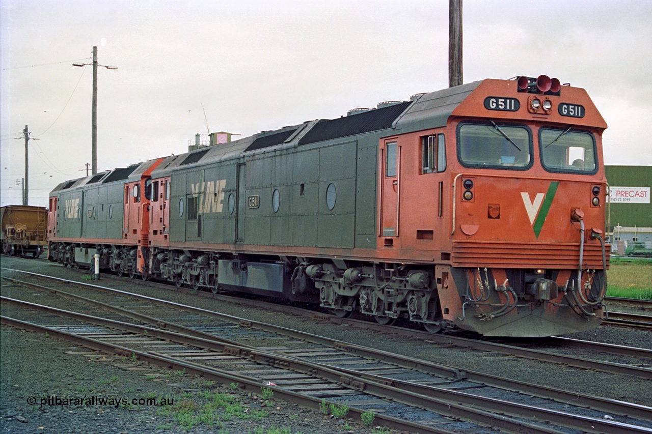 111-36
North Geelong yard, V/Line broad gauge light engines Series 1 G class leader G 511 Clyde Engineering EMD model JT26C-2SS serial 84-1239 and G class G 538 Clyde Engineering EMD model JT26C-2SS serial 89-1271 shunt onto the empty grain train 9123.
Keywords: G-class;G511;Clyde-Engineering-Rosewater-SA;EMD;JT26C-2SS;84-1239;