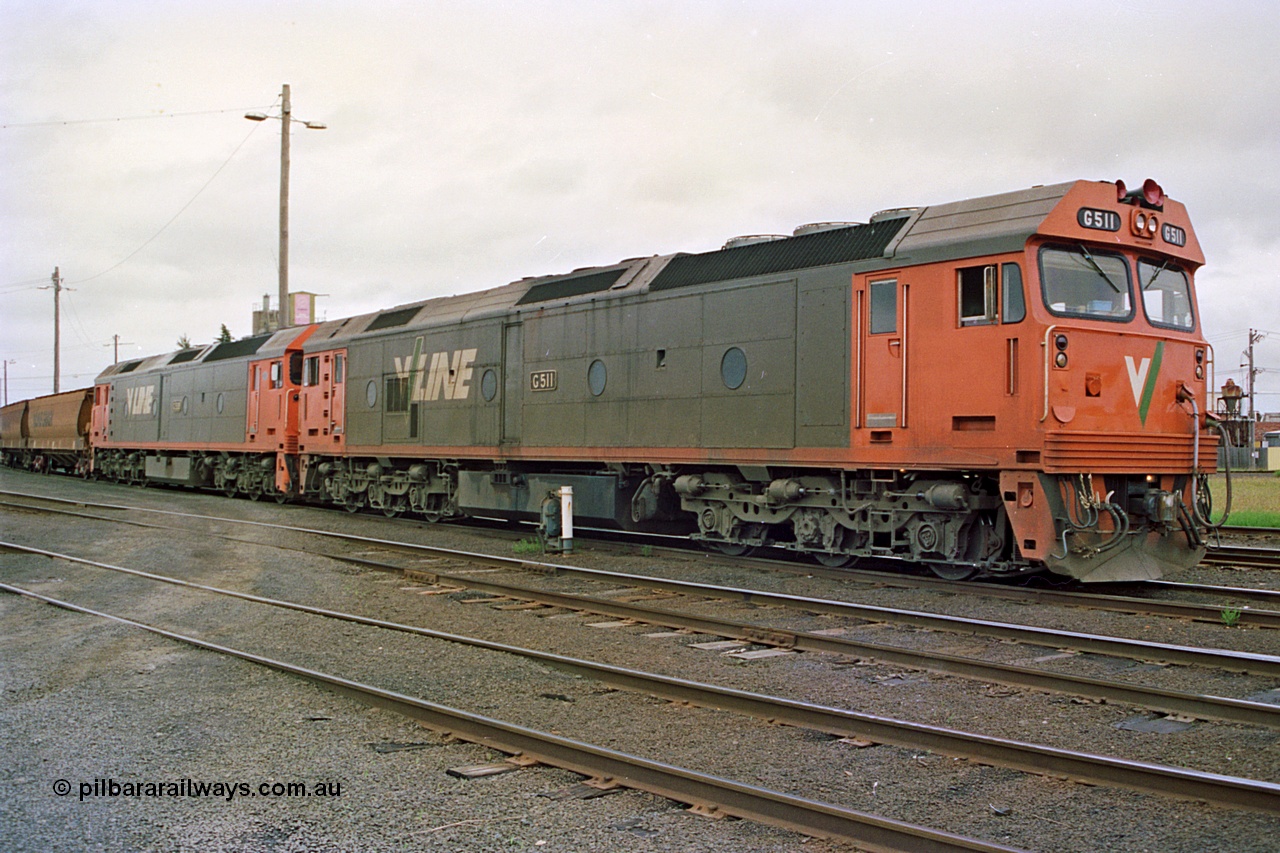 111-37
North Geelong yard, V/Line broad gauge grain train 9123 with power from locomotives Series 1 G class leader G 511 Clyde Engineering EMD model JT26C-2SS serial 84-1239 and G class G 538 Clyde Engineering EMD model JT26C-2SS serial 89-1271 sit beside electric ground dwarf signal 20 awaiting departure time.
Keywords: G-class;G511;Clyde-Engineering-Rosewater-SA;EMD;JT26C-2SS;84-1239;