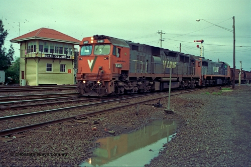 111-04
North Geelong C Box, V/Line broad gauge locos N class N 461 'City of Ararat' Clyde Engineering EMD model JT22HC-2 serial 86-1190 and X class X 47 Clyde Engineering EMD model G26C serial 75-794 head down the grain loop line, signal box, semaphore signal post, the line in the foreground is the Loop Line to Melbourne.
Keywords: N-class;N461;Clyde-Engineering-Somerton-Victoria;EMD;JT22HC-2;86-1190;