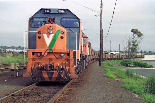 111-16
North Geelong grain arrivals yard, V/Line broad gauge loco X class X 47 Clyde Engineering EMD model G26C serial 75-794 and N class N 461 'City of Ararat' Clyde Engineering EMD model JT22HC-2 serial 86-1190 with a loaded grain loop have their crib break before heading back to the grain loop.
Keywords: X-class;X47;Clyde-Engineering-Rosewater-SA;EMD;G26C;75-794;