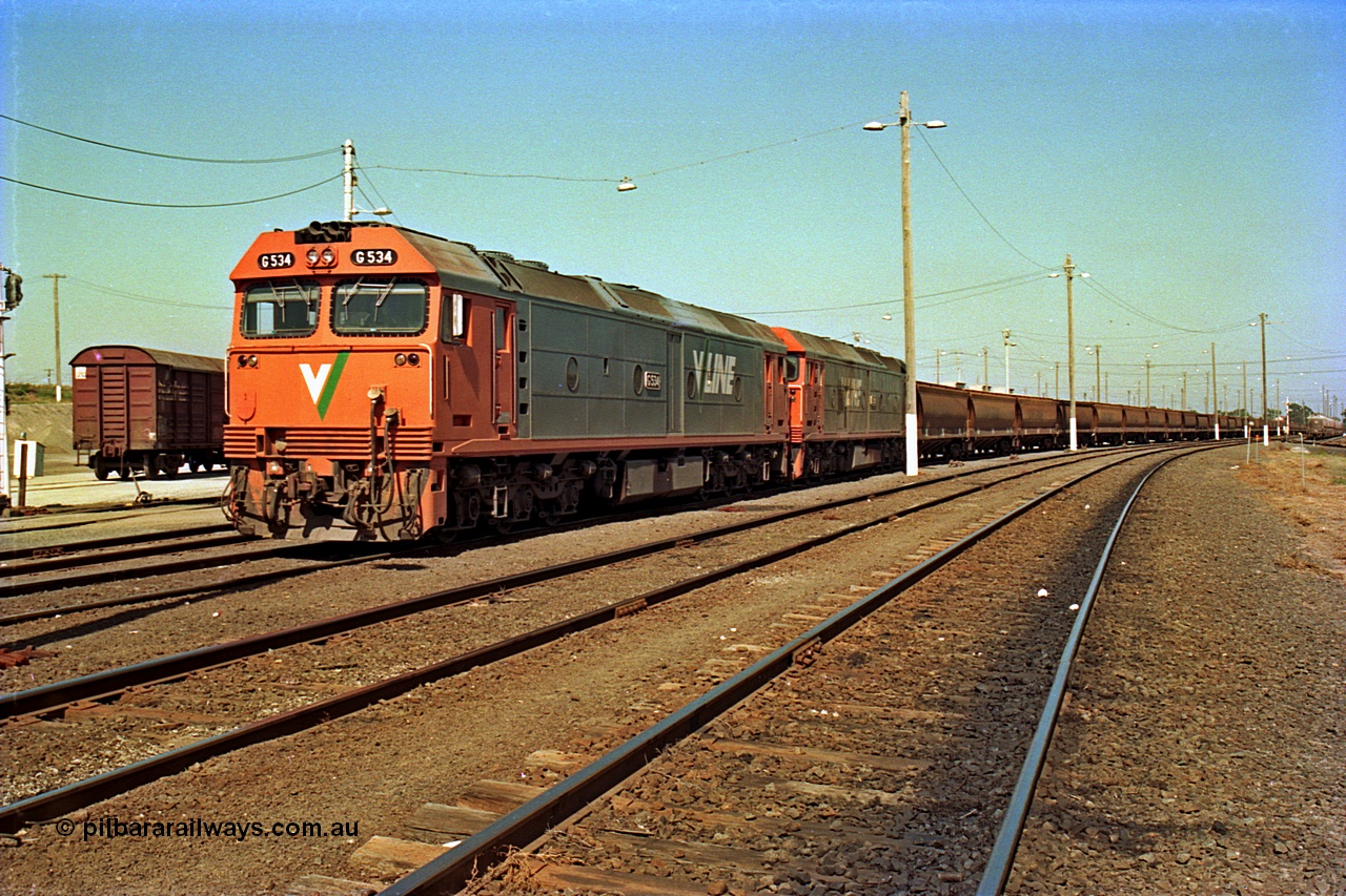 112-13
North Geelong yard broad gauge track view, V/Line G class G 534 Clyde Engineering EMD model JT26C-2SS serial 88-1264 and sister loco with an empty grain train awaiting departure on No.1 Rd Sorting Sidings.
Keywords: G-class;G534;Clyde-Engineering-Somerton-Victoria;EMD;JT26C-2SS;88-1264;