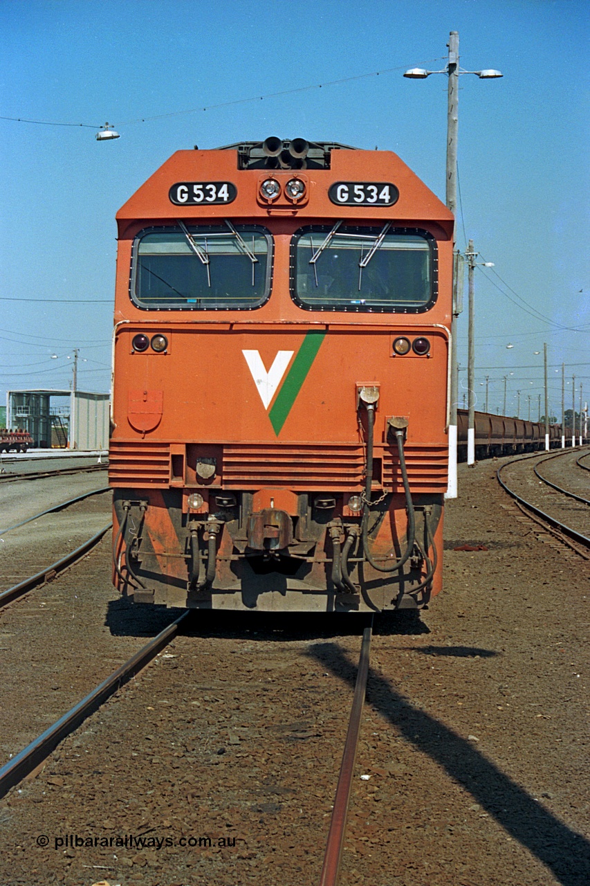 112-14
North Geelong yard, broad gauge V/Line G class G 534 Clyde Engineering EMD model JT26C-2SS serial 88-1264 front view, grain train.
Keywords: G-class;G534;Clyde-Engineering-Somerton-Victoria;EMD;JT26C-2SS;88-1264;