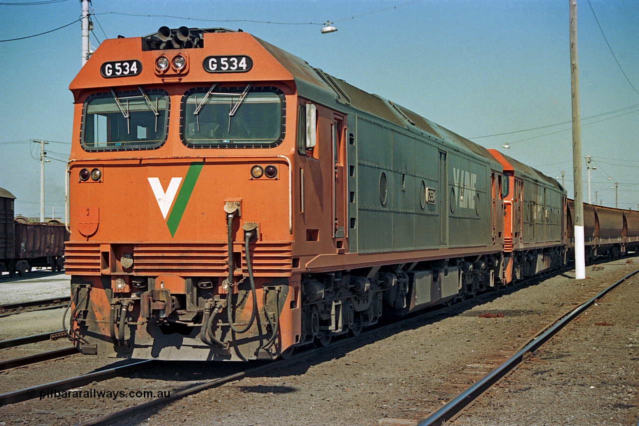 112-15
North Geelong yard, broad gauge V/Line G class G 534 Clyde Engineering EMD model JT26C-2SS serial 88-1264 and sister G class empty grain train, No.1 Rd Sorting Sidings.
Keywords: G-class;G534;Clyde-Engineering-Somerton-Victoria;EMD;JT26C-2SS;88-1264;