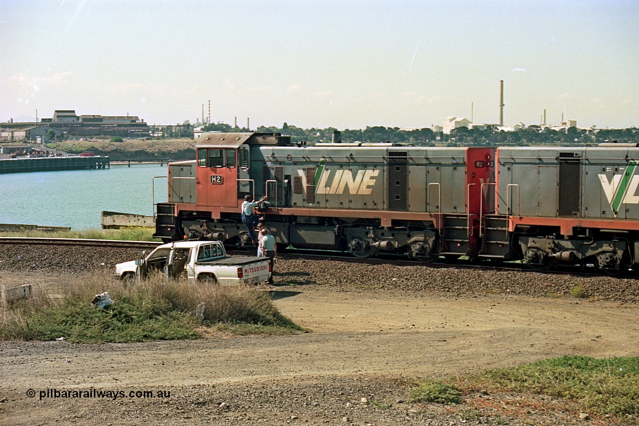 112-26
North Geelong grain loop, V/Line broad gauge H class H 2 Clyde Engineering EMD model G18B serial 68-630, LHS view coupled to sister H 5 serial 68-632, grain loop unloading operations, crew change taking effect.
Keywords: H-class;H2;Clyde-Engineering-Granville-NSW;EMD;G18B;68-630;H5;68-632;