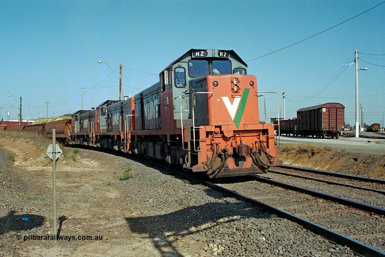 112-30
North Geelong C Box, on the North Goods Loop Line V/Line broad gauge H class locos H 2 Clyde Engineering EMD model G18B serial 68-630 leads sisters H 5 serial 68-632 and H 4 serial 68-633 back from the grain loop, Loop Line to Melbourne to left of frame, North Geelong yard to the right.
Keywords: H-class;H2;Clyde-Engineering-Granville-NSW;EMD;G18B;68-630;H5;68-632;H4;68-633;