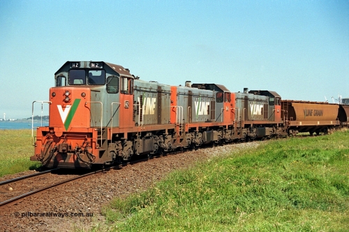 112-20
North Geelong grain loop, V/Line broad gauge locos H class H 2 Clyde Engineering EMD model G18B serial 68-630, H 5 serial 68-632 and H 4 serial 68-633 shunt around the grain loop unloading a grain train.
Keywords: H-class;H2;Clyde-Engineering-Granville-NSW;EMD;G18B;68-630;H5;68-632;H4;68-633;