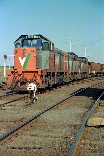 112-33
North Geelong C Box, V/Line broad gauge H class locos H 2 Clyde Engineering EMD model G18B serial 68-630, H 5 serial 68-632 and H 4 serial 68-633, empty grain train North Geelong yard, shunter in background cutting off locos, ground dwarf signal 18.
Keywords: H-class;H2;Clyde-Engineering-Granville-NSW;EMD;G18B;68-630;H5;68-632;H4;68-633;