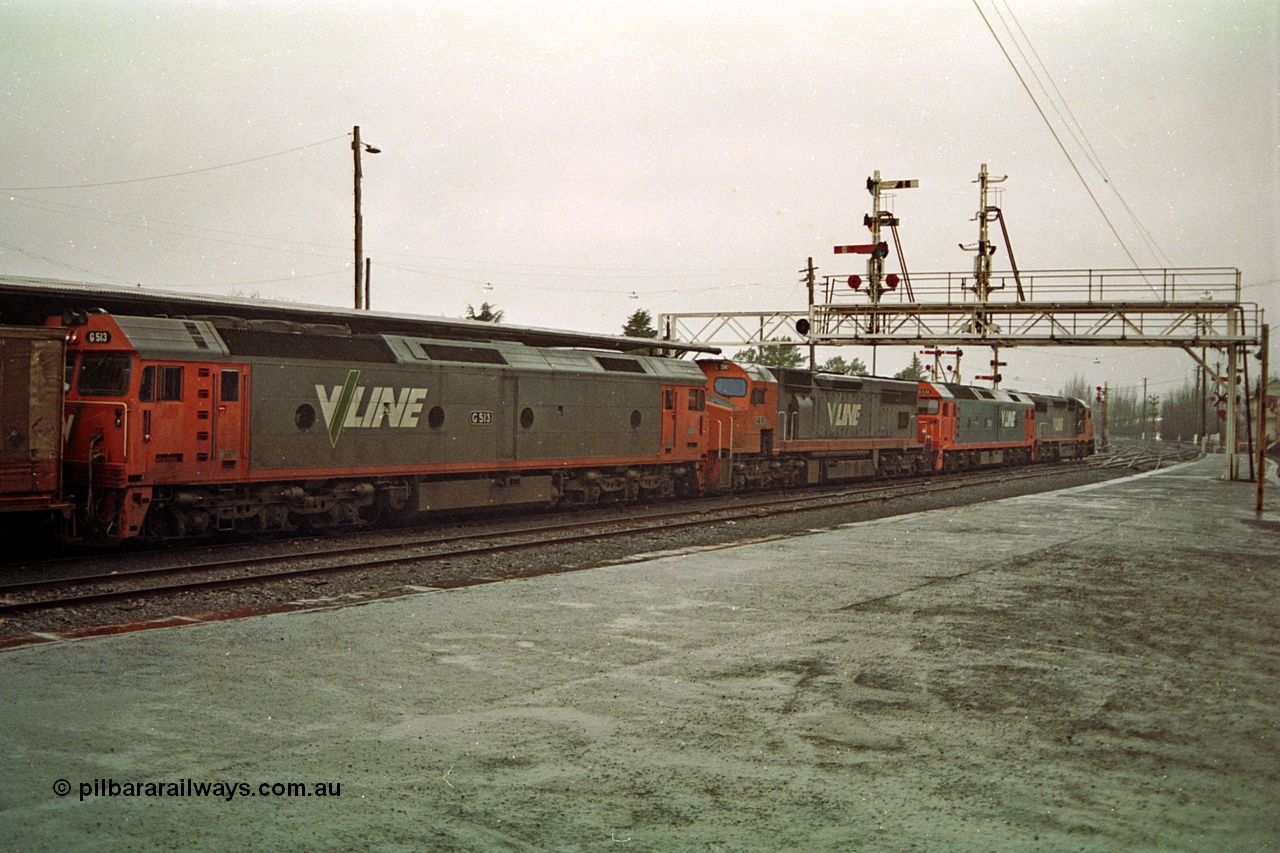 113-03
Ballarat station platform No.2, signal gantry with stripped doll, V/Line broad gauge up Adelaide goods train 9150 behind the quad CGCG combo of C class C 506 Clyde Engineering EMD model GT26C serial 76-829, G class G 538 Clyde Engineering EMD model JT26C-2SS serial 89-1271, C class C 510 serial 76-833 and G class G 513 serial 85-1241, in miserable conditions, poor quality.
Keywords: G-class;G513;Clyde-Engineering-Rosewater-SA;EMD;JT26C-2SS;85-1241;