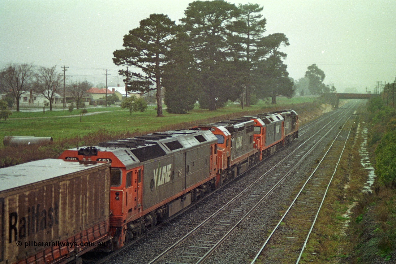 113-05
Ballarat East loco depot, Queen St bridge in distance, line at right is the former Eureka line, V/Line broad gauge up Adelaide goods train 9150 behind the quad CGCG combo of C class C 506 Clyde Engineering EMD model GT26C serial 76-829, G class G 538 Clyde Engineering EMD model JT26C-2SS serial 89-1271, C class C 510 serial 76-833 and G class G 513 serial 85-1241, in miserable conditions, poor quality.
Keywords: G-class;G513;Clyde-Engineering-Rosewater-SA;EMD;JT26C-2SS;85-1241;