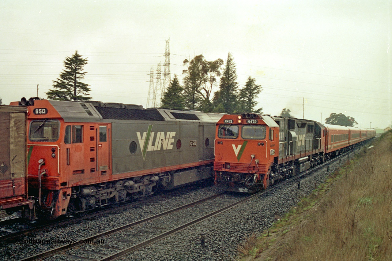 113-09
Warrenheip, V/Line broad gauge up Adelaide goods train 9150 with forth unit visible G class G 513 Clyde Engineering EMD model JT26C-2SS serial 85-1241, is crossed by down passenger train hauled by N class N 472 'City of Sale' Clyde Engineering EMD model JT22HC-2 serial 87-1201 and a double N set, in miserable conditions, poor quality.
Keywords: N-class;N472;Clyde-Engineering-Somerton-Victoria;EMD;JT22HC-2;87-1201;