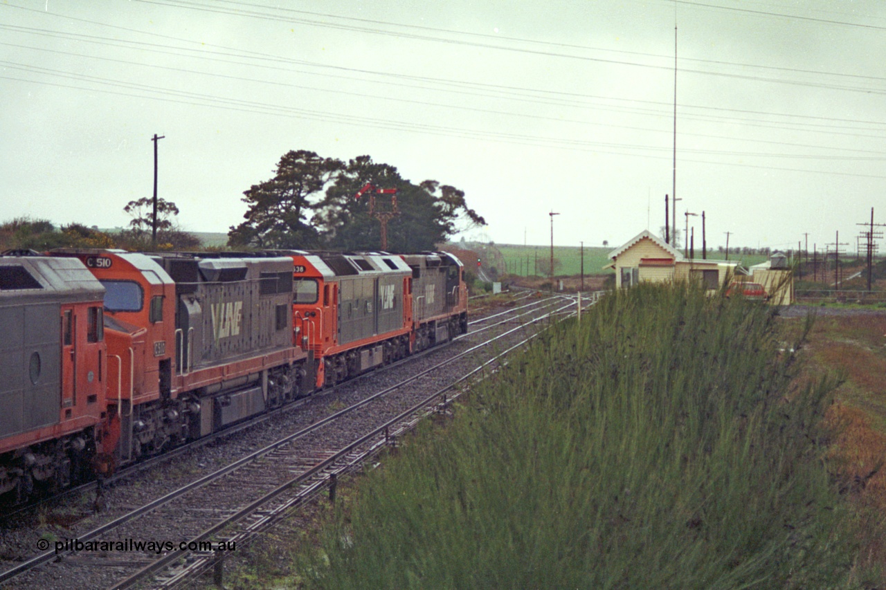 113-11
Warrenheip, V/Line broad gauge up Adelaide goods train 9150 behind the quad CGCG combo of C class C 506 Clyde Engineering EMD model GT26C serial 76-829, G class G 538 Clyde Engineering EMD model JT26C-2SS serial 89-1271, C 510 serial 76-833 and G 513 serial 85-1241, departing for Melbourne via Bacchus Marsh, semaphore signal post 9 pulled off for move, signal box and overview, in miserable conditions, poor quality.
Keywords: C-class;C510;Clyde-Engineering-Rosewater-SA;EMD;GT26C;76-833;